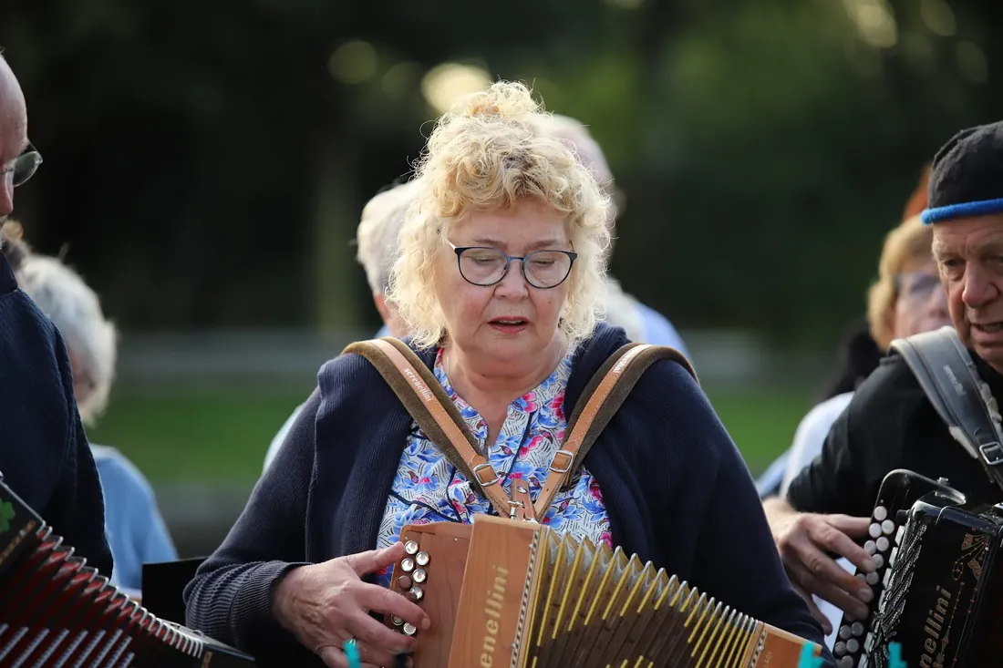 An accordion player in the choir, mid-song